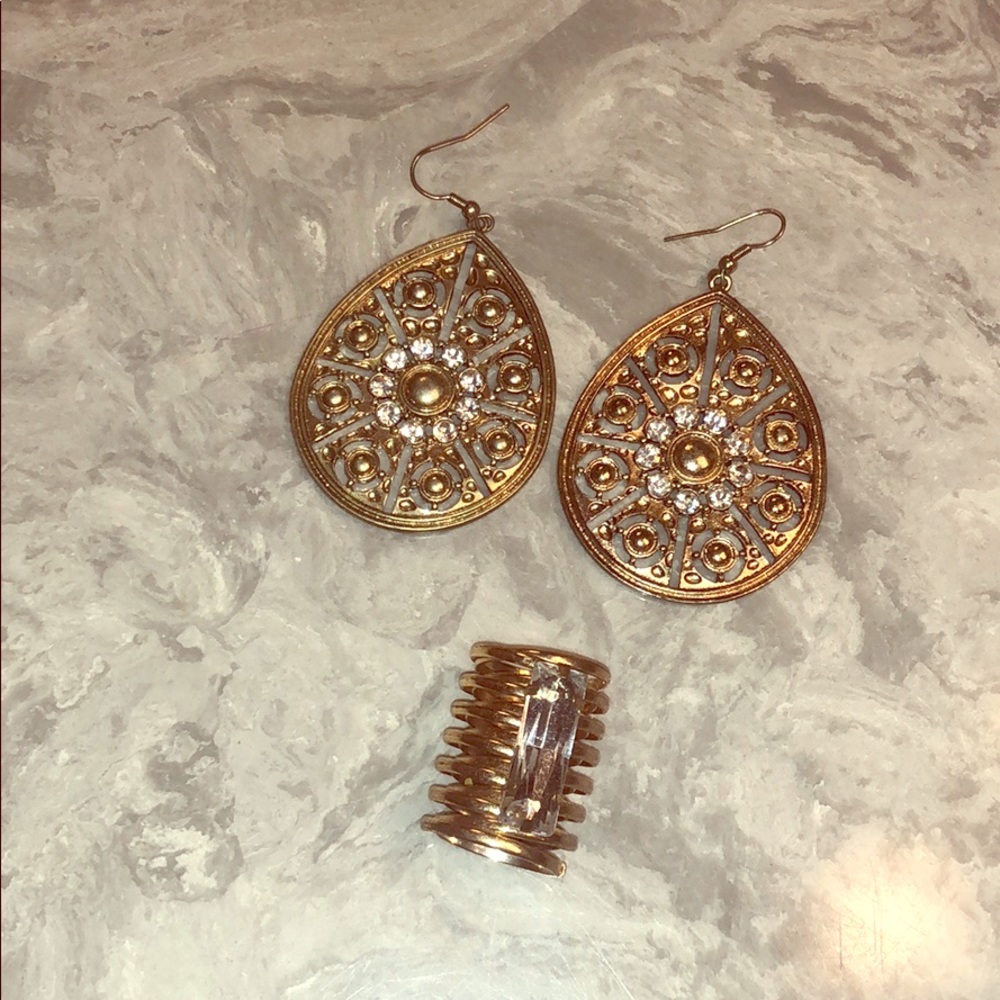 Hanging earrings and large ring